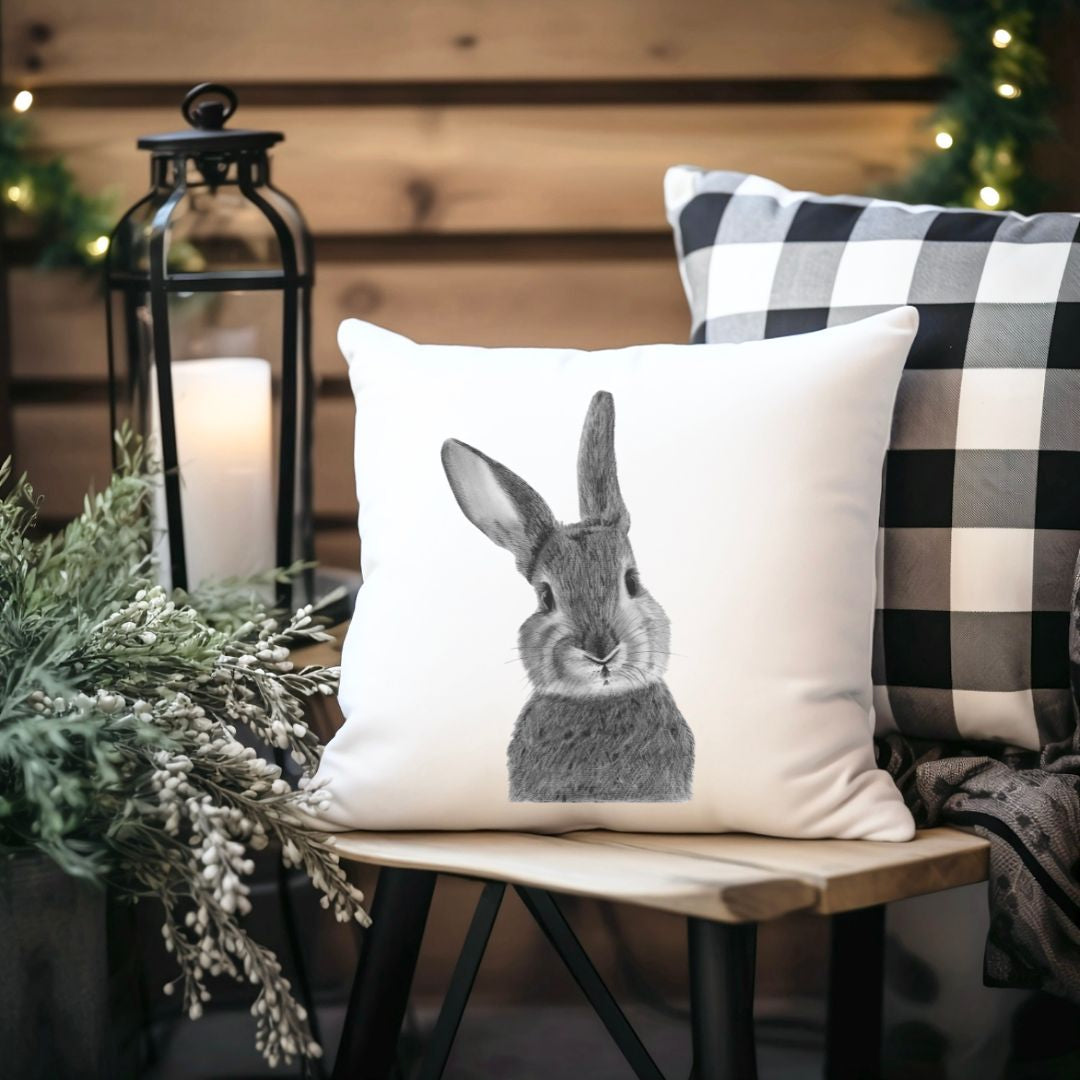A soft faux suede cushion showcasing a detailed hand-drawn bunny design, perfect for animal lovers and rustic countryside-inspired home décor.