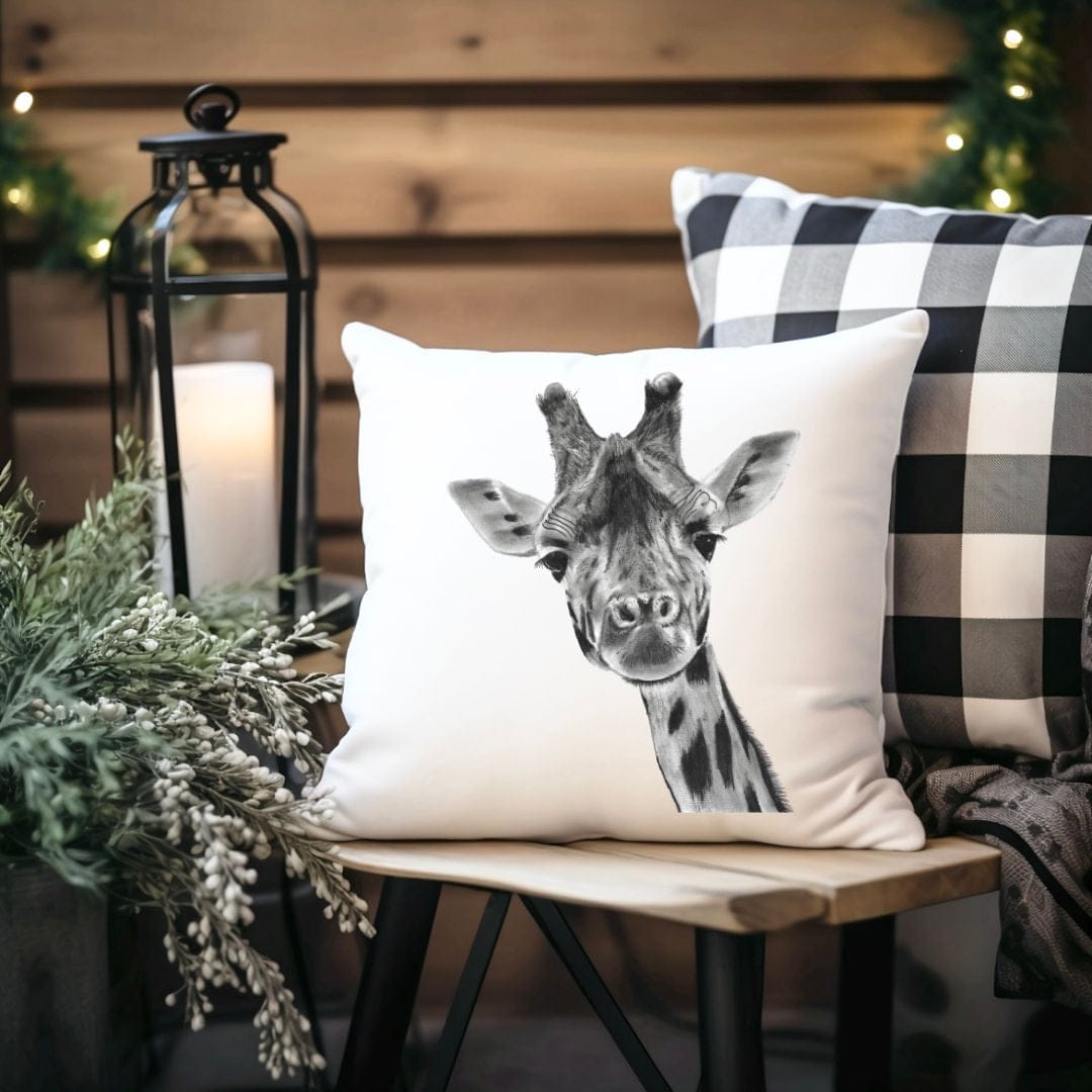 A soft faux suede cushion showcasing a detailed hand-drawn giraffe, ideal for wildlife enthusiasts and safari-inspired home décor.