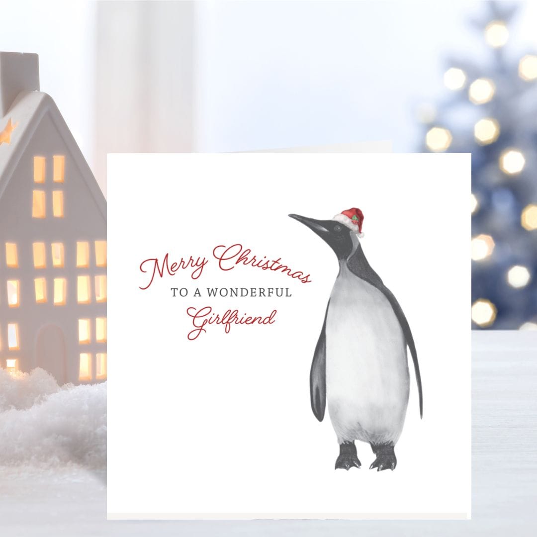 A festive penguin Christmas card for a wonderful girlfriend, beautifully hand-drawn by Libra Fine Arts.