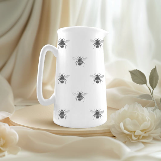 Delicate fine bone china jug featuring hand-drawn busy bees, perfect for springtime tables and nature lovers.