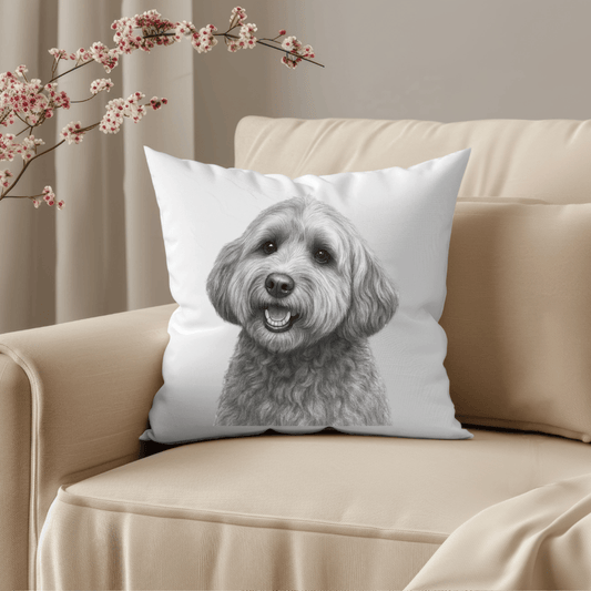 Pillow with a dog design on a beige couch with floral decorations.
