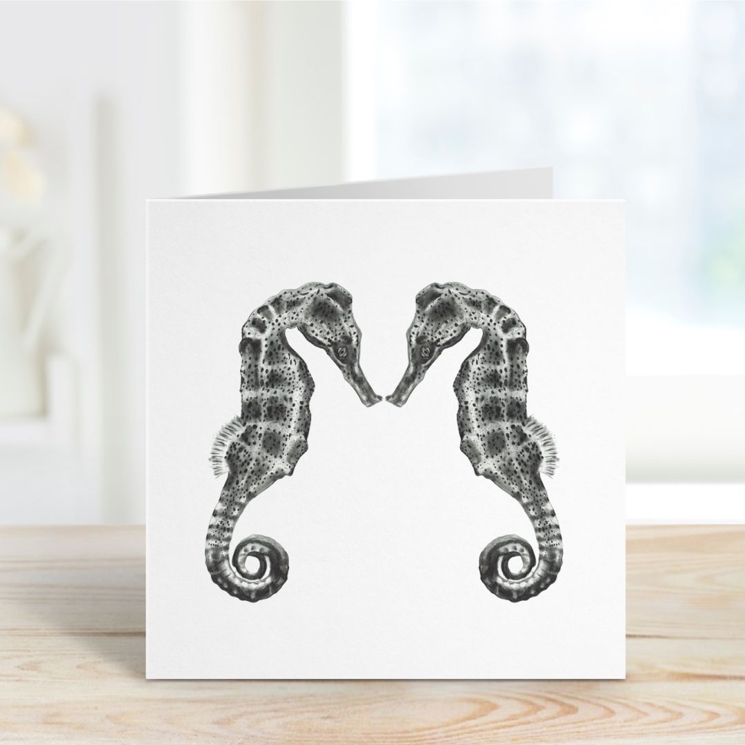 An enchanting greeting card showcasing Diya the seahorse and her companion amidst colorful coral reefs, an excellent choice for those who appreciate marine-themed artwork.