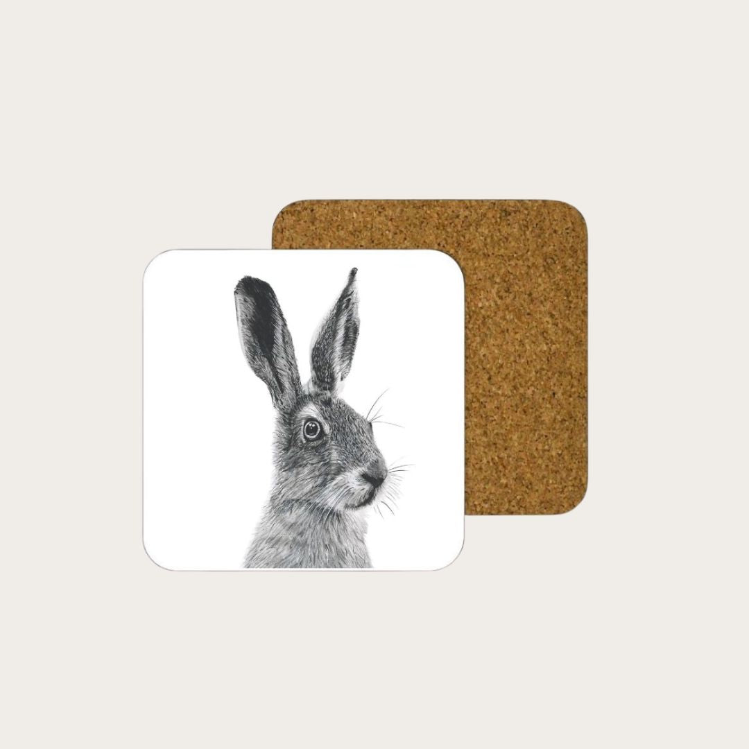 Enhance your coffee table with the Floras the Hare drinks coaster, featuring a charming hare illustration. Made from high-quality materials, this coaster protects your surfaces while adding a touch of nature-inspired beauty to your home. Available individually or in packs of four at Libra Fine Arts. (librafinearts.co.uk)

