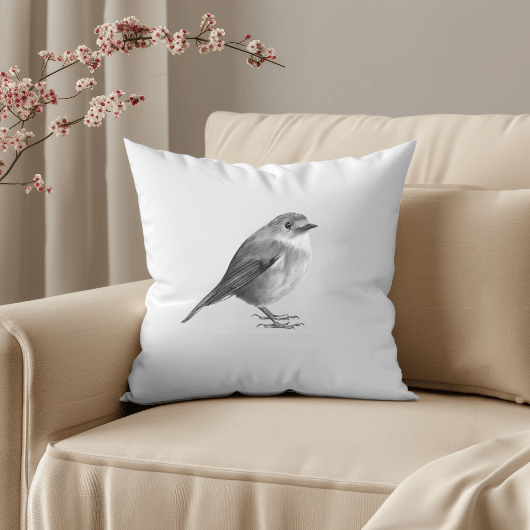 Decorative cushion featuring a detailed hand-drawn robin illustration, perfect for wildlife lovers and adding a festive, cozy touch to home decor.