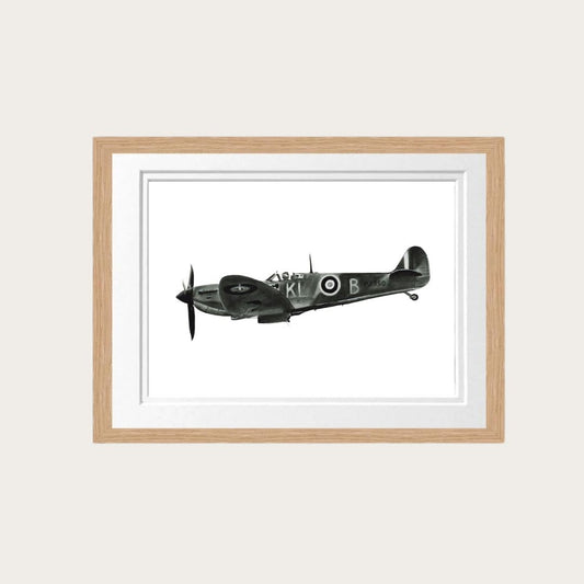 An exquisite art print titled "Flying Home," featuring a hand-drawn illustration of a Spitfire aircraft in flight. Framed in natural oak, the print measures 24x31 inches, with the artwork itself 20x27 inches. A perfect addition to any aviation art collection, this piece commemorates the legacy of World War II fighter planes. 