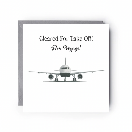 Greeting card with airplane illustration and text 'Cleared For Take Off! Bon Voyage!' on a white background.