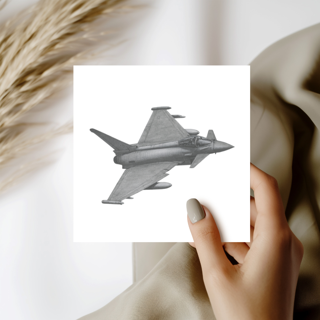 Hand holding a card with a jet plane illustration against a neutral background