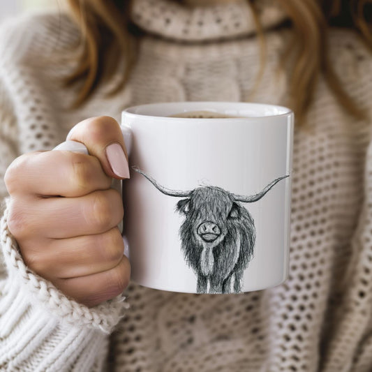 This beautiful Highland Cow Bone China Mug showcases a detailed hand-illustrated design of the iconic Highland cow. Made from fine bone china, this elegant mug is perfect for animal lovers, nature enthusiasts, and anyone who appreciates the rustic charm of country life