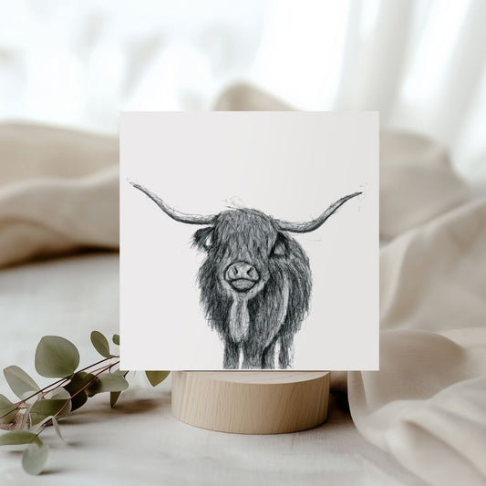 Beautiful hand-illustrated greeting card featuring a Highland Cow, ideal for sending heartfelt messages to animal and nature enthusiasts.

