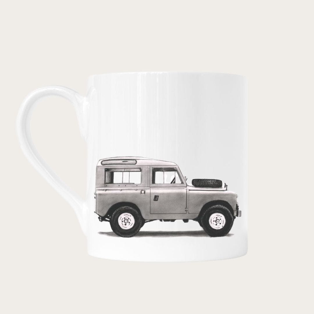 Celebrate your love for Land Rover with this beautifully designed bone china mug. Featuring an intricate Land Rover illustration, this mug brings elegance and automotive passion to your daily routine, making it an ideal gift for car lovers and collectors alike.
