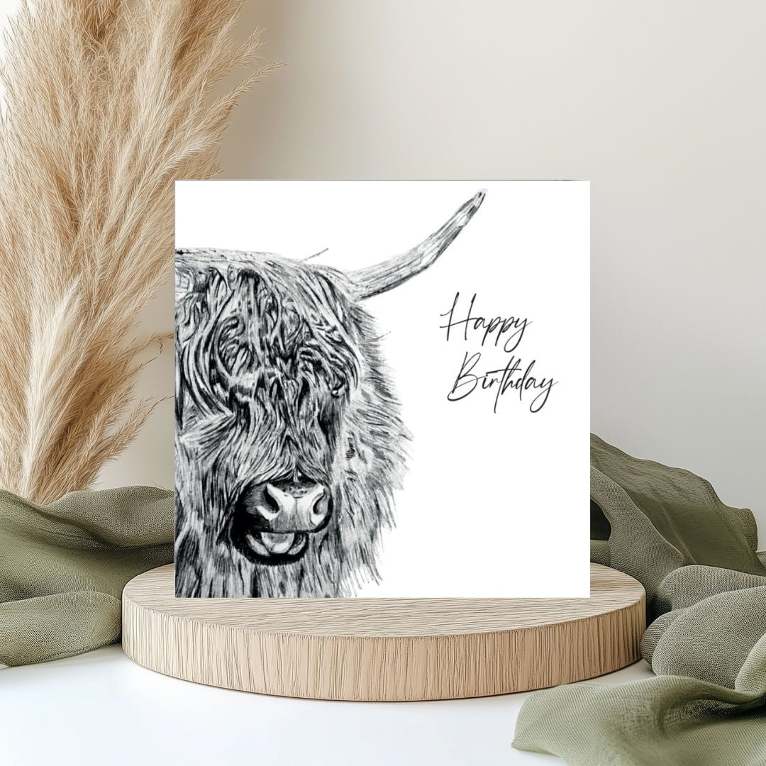 Menkar Highland Cow Happy Birthday Card – A hand-drawn design featuring a majestic Highland cow, ideal for celebrating a special birthday