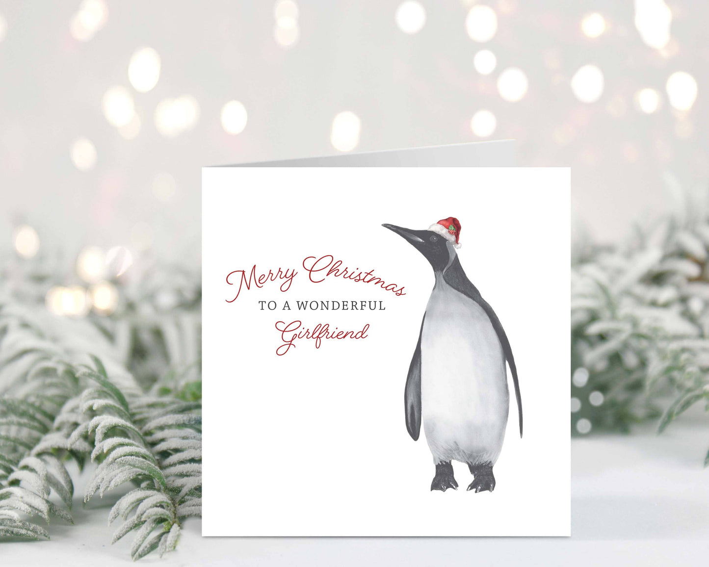 Charming hand-drawn festive penguin Christmas card for a wonderful girlfriend, created by Libra Fine Arts.