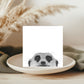 A delightful hand-illustrated greeting card featuring Myra the meerkat peeking from her habitat, perfect for sending cheerful messages to animal enthusiasts.