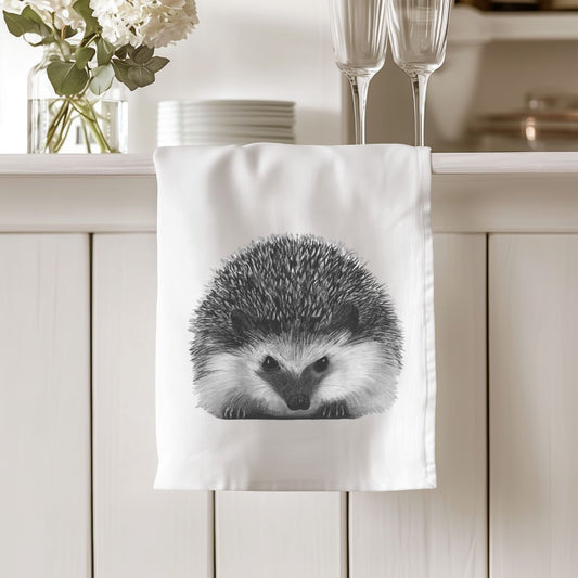 Organic tea towel featuring Persei the Hedgehog, a charming and eco-conscious addition to your kitchen. Ideal for hedgehog lovers and sustainable home decor.