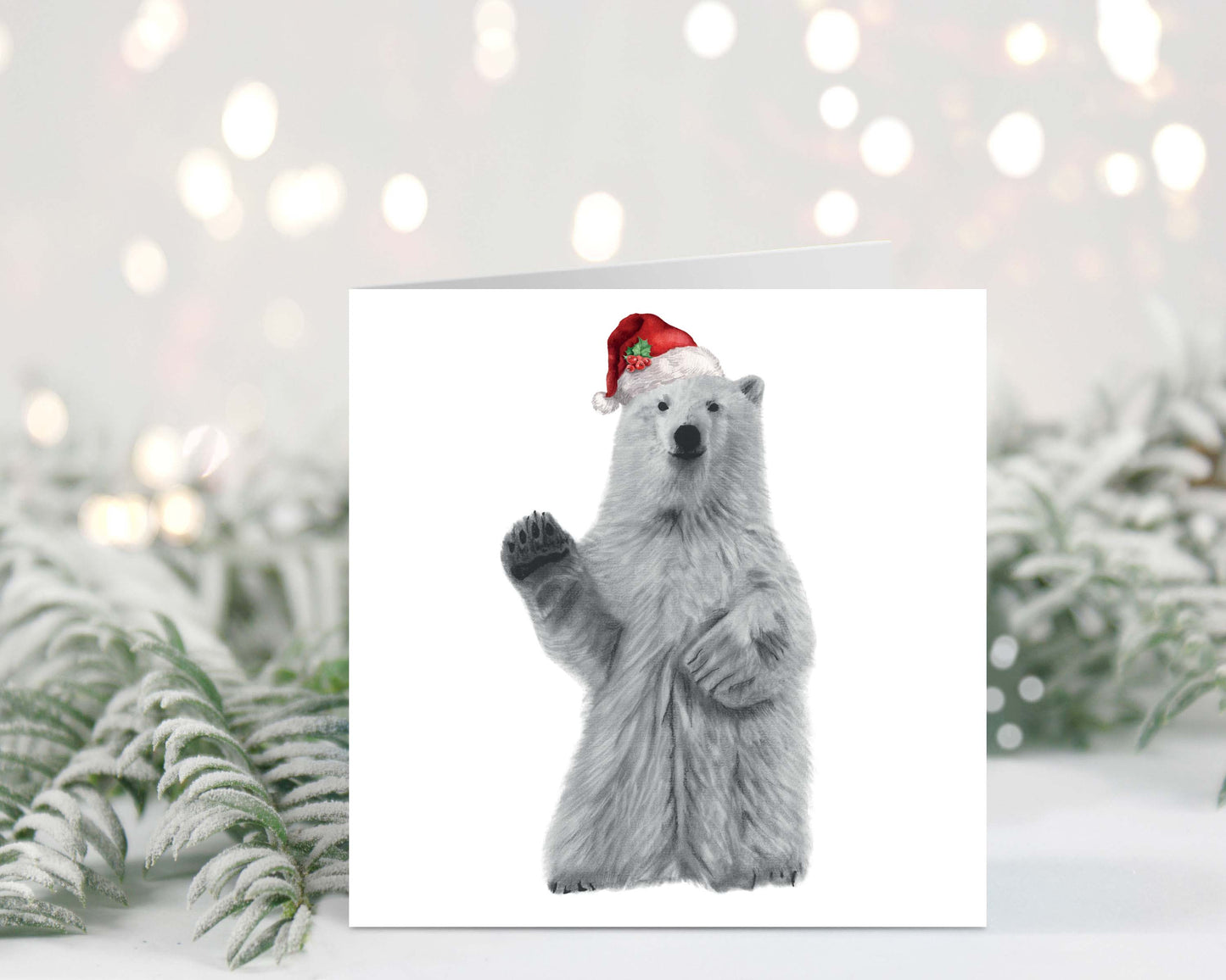 Polar Bear wearing a festive red hat, perfect for spreading Christmas cheer with this adorable Christmas card