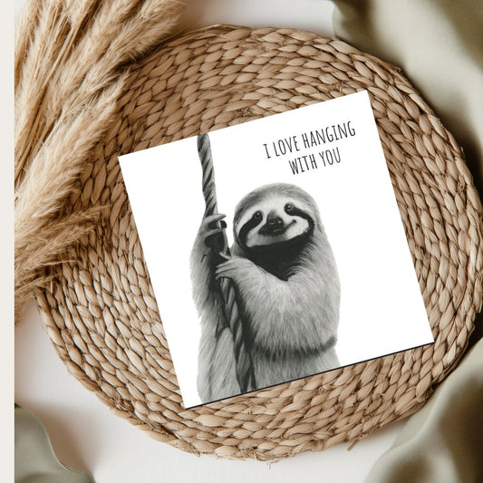 Cute hand-drawn sloth Father's Day greeting card, featuring a playful 'I Love Hanging with You' message. Perfect for animal lovers and dads who enjoy relaxed, fun designs. A charming card to celebrate Father’s Day with a laid-back touch