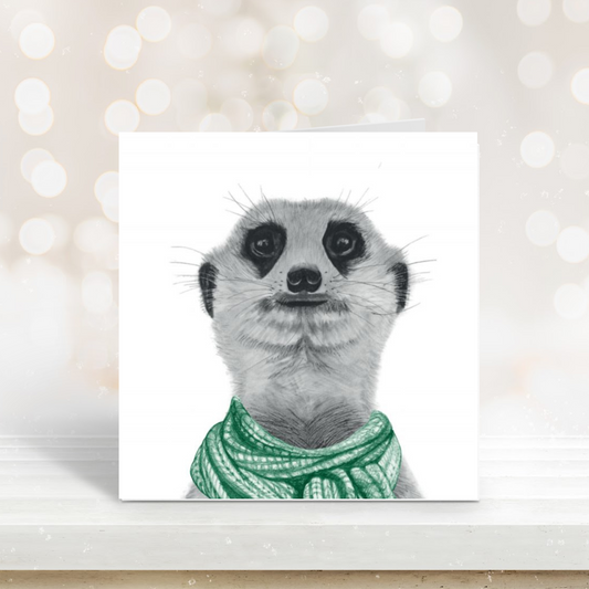 Cute illustration of a meerkat wearing a green scarf on a festive winter card.

