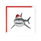 Vega the shark wearing a jolly Santa hat, hand-drawn festive Christmas greeting card.