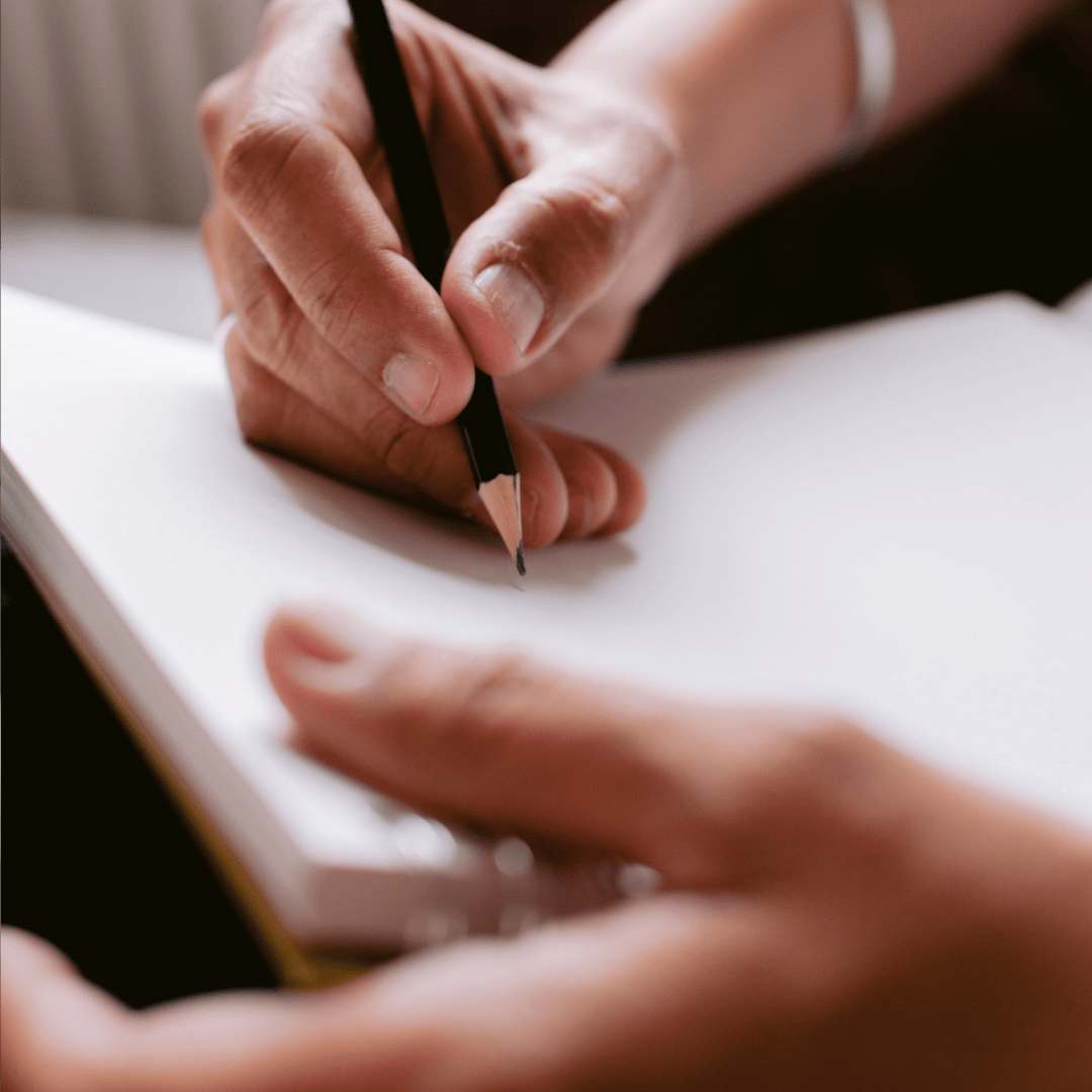 picture of artist drawing with pencil