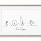 Las Vegas skyline with handwritten city name – oak frame with white mount