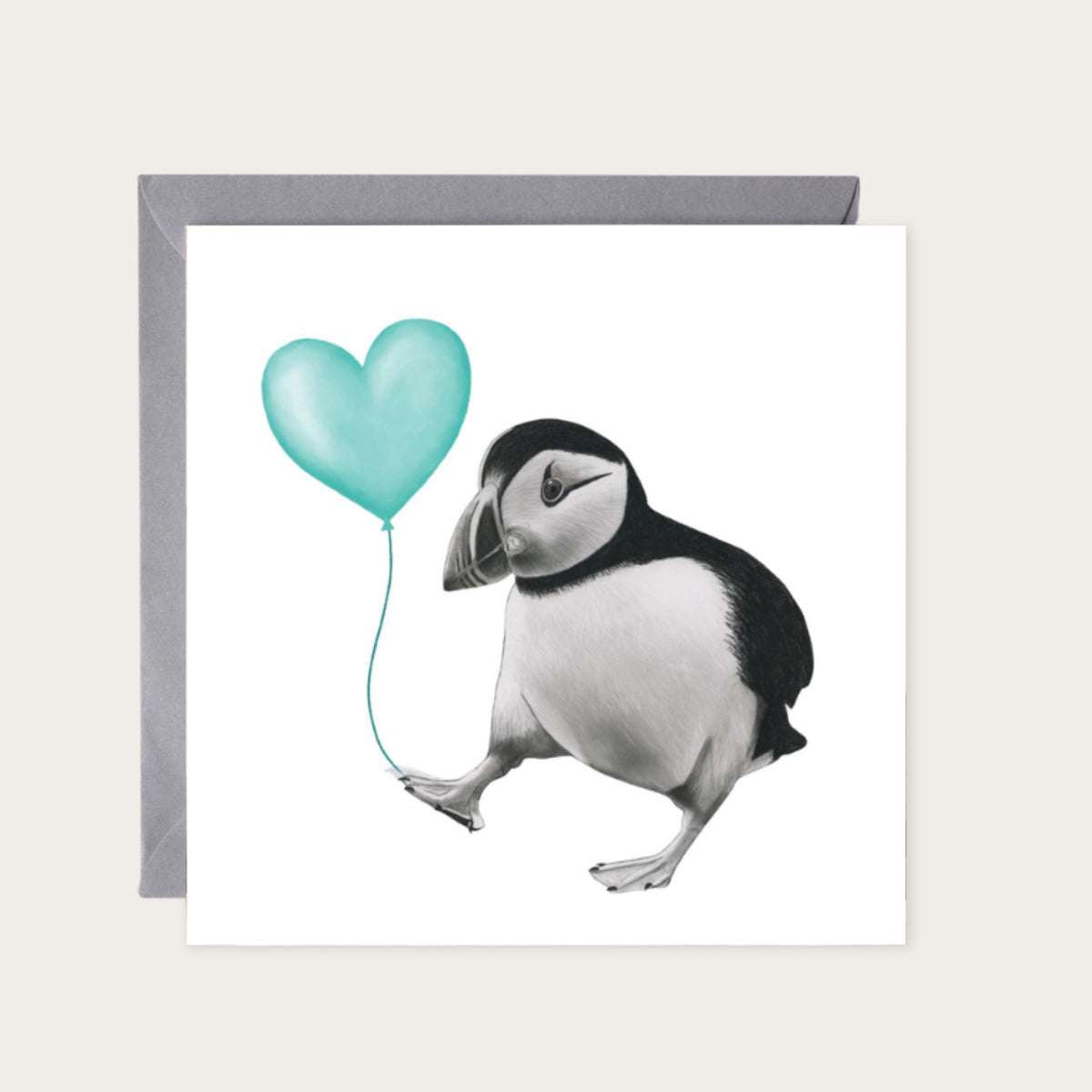 Floating Puffin – Teal Balloon Hand-Drawn Greeting Card | Cute & Whimsical Sealife Art — card with grey envelope