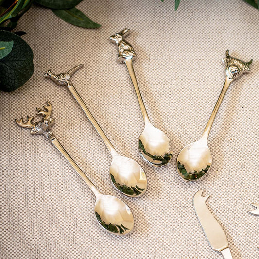 A set of 4 animal teaspoons featuring beautifully detailed designs of a stag, pheasant, rabbit, and Highland cow on the handles. The elegant spoons add a rustic, nature-inspired touch to any table setting, perfect for serving condiments, desserts, or stirring beverages.