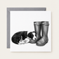 Sleeping Puppy & Wellies greeting card with a grey envelope behind it
