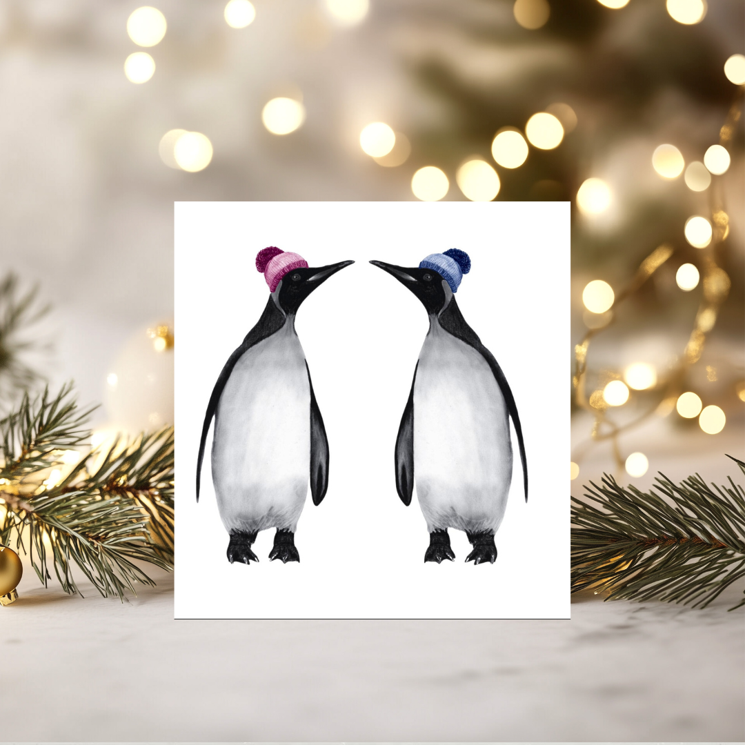 Two Winter Penguins Christmas Card – Topped with Woolly Hats & Full of Cheer