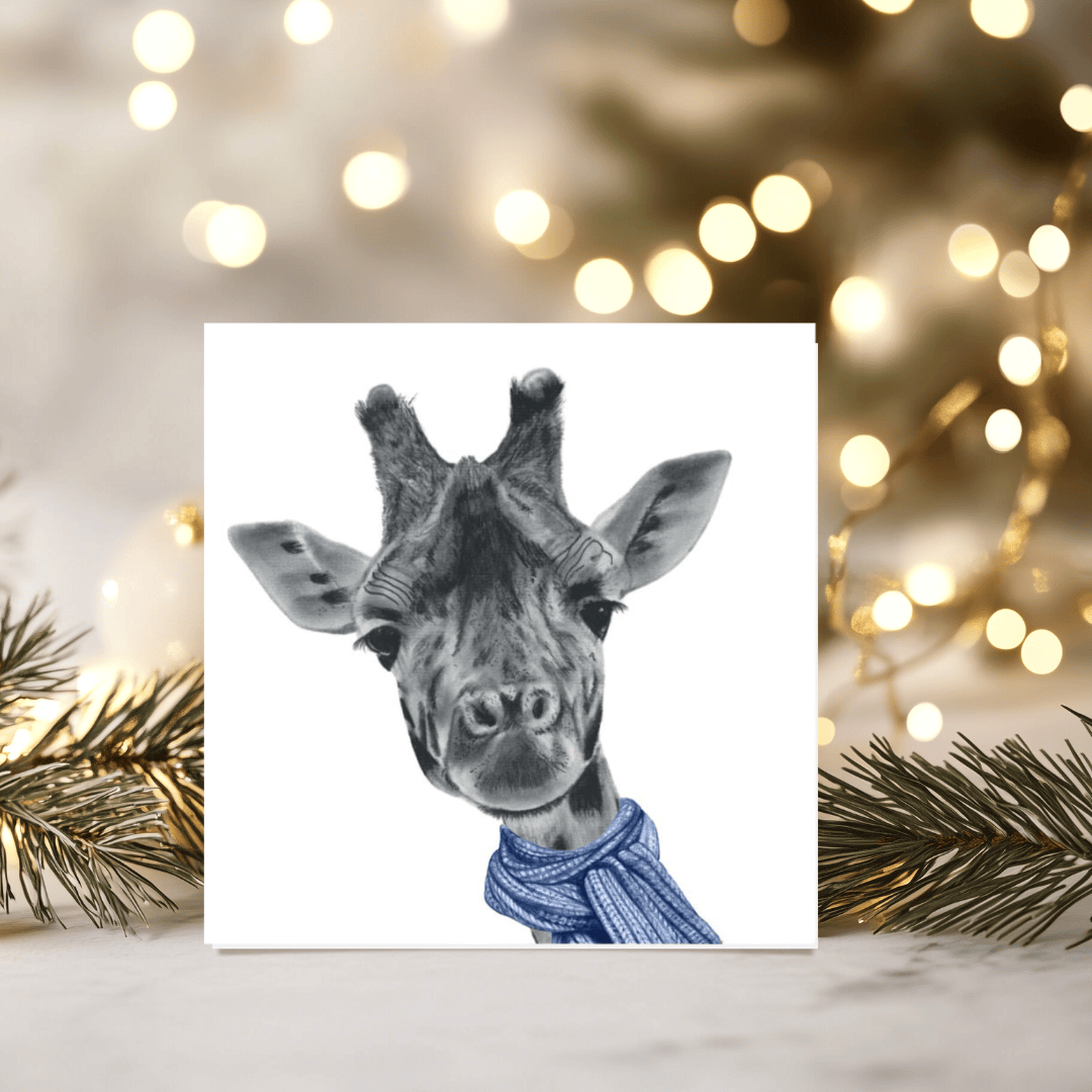 Winter Giraffe Christmas Card – Tall, Elegant & Wrapped in Blue