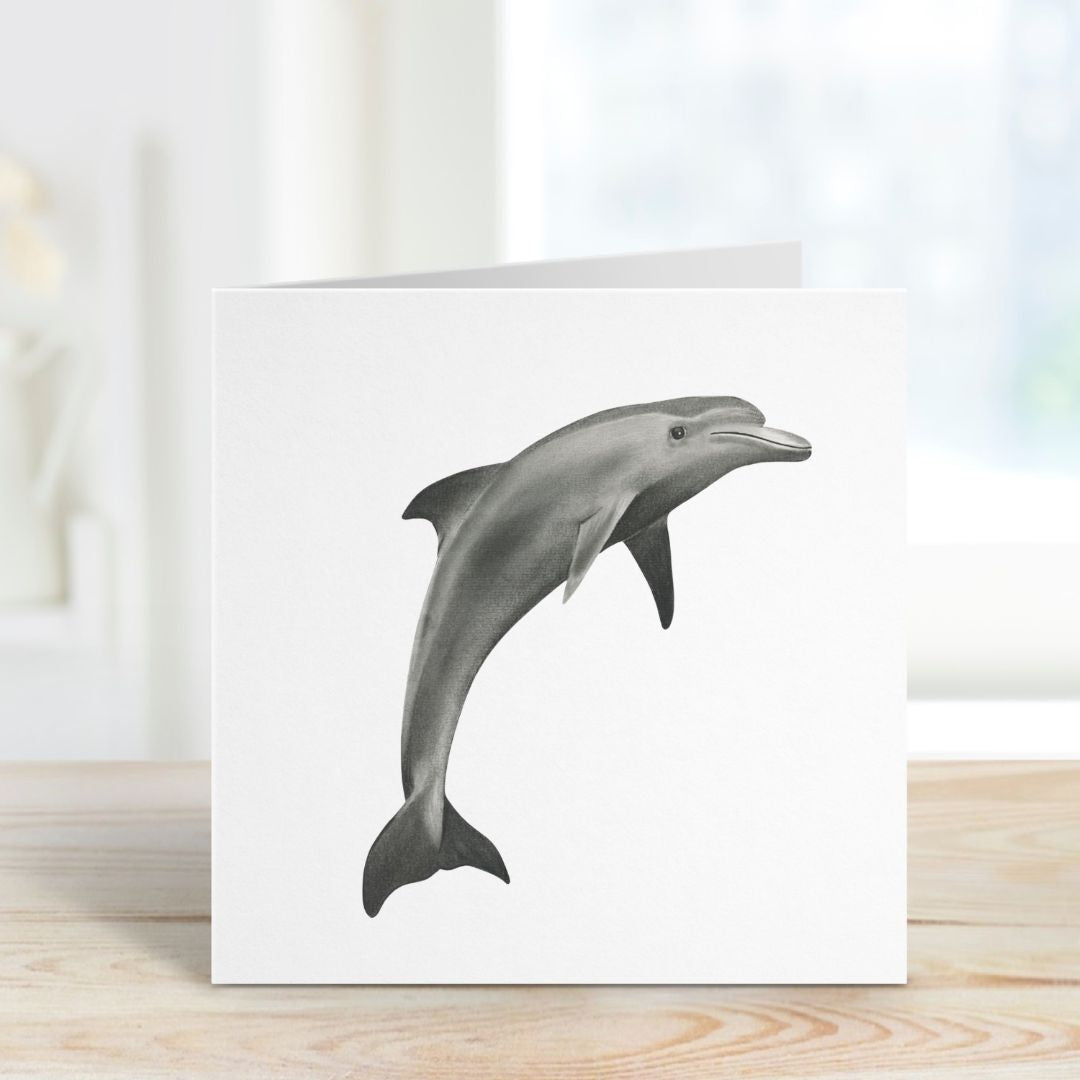 A standing hand-drawn Dolphin Greeting Card from Libra Fine Arts, beautifully displayed, perfect for ocean and wildlife enthusiasts.