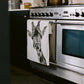 A hand-drawn giraffe tea towel, made from premium cotton, hanging over an oven door. With its unique wildlife-inspired design, this towel adds a whimsical touch to your kitchen. A perfect gift for animal lovers, it combines practicality with a delightful nature theme, making it a lovely addition to any home.