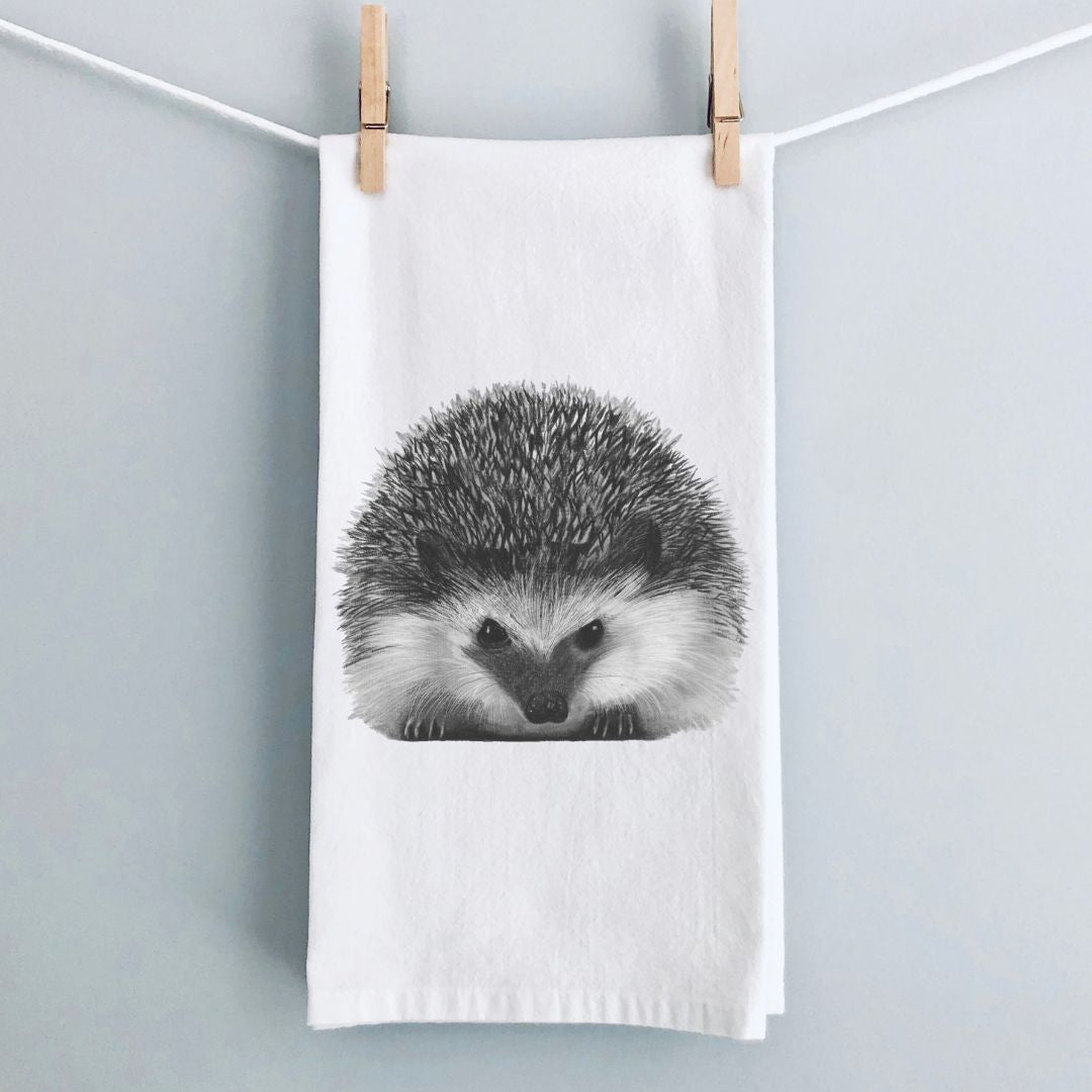 Hedgehog Premium Tea Towel From Libra Fine Arts . Hedgehog Cotton Tea Towels: A set of charming tea towels made from soft, high-quality cotton, featuring delightful hand-drawn hedgehog designs. Perfect for adding a whimsical touch to your kitchen, these towels also make a thoughtful gift for hedgehog enthusiasts and animal lovers