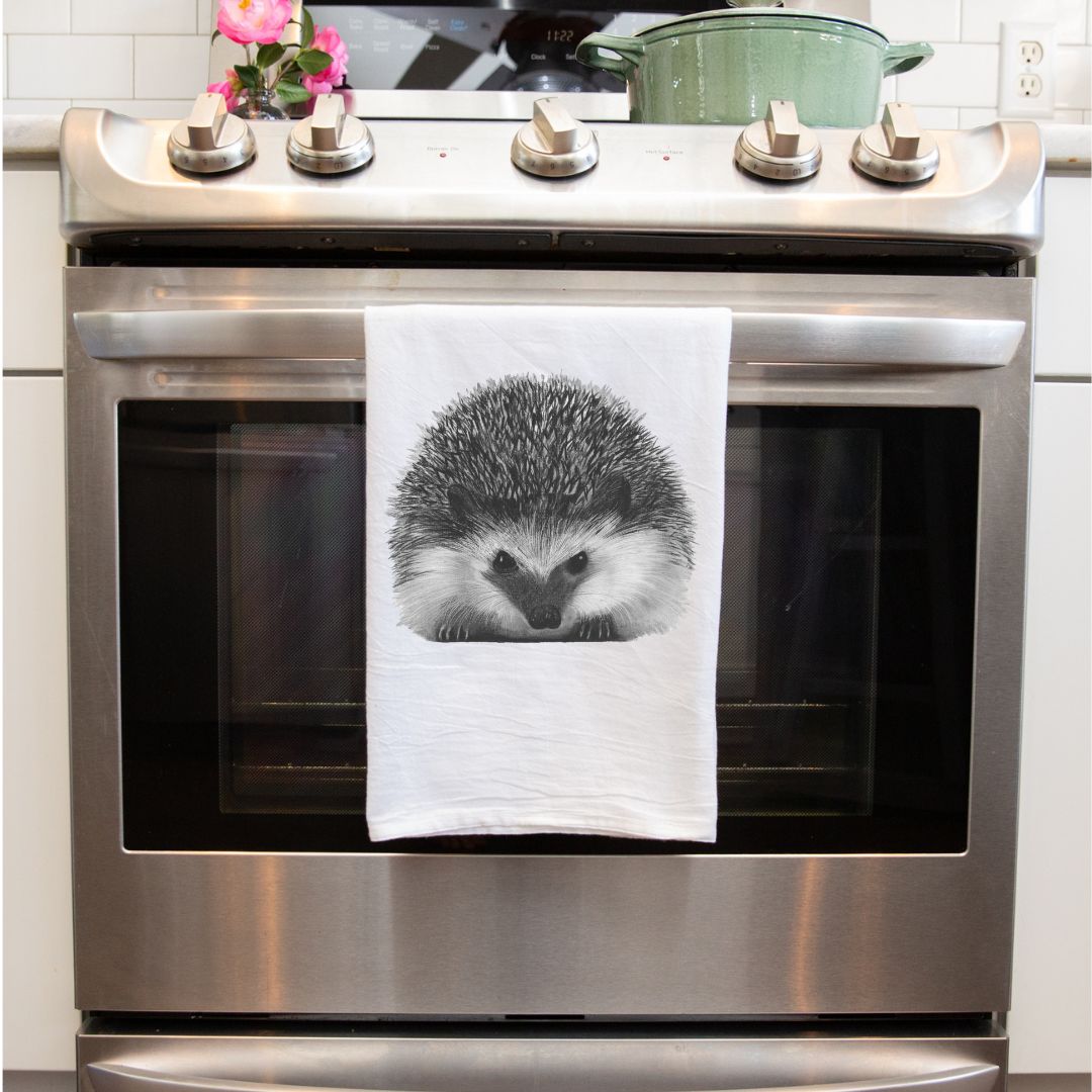 Hedgehog Premium Tea Towel From Libra Fine Arts . Hedgehog Cotton Tea Towels: A set of charming tea towels made from soft, high-quality cotton, featuring delightful hand-drawn hedgehog designs. Perfect for adding a whimsical touch to your kitchen, these towels also make a thoughtful gift for hedgehog enthusiasts and animal lovers